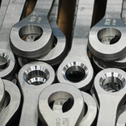 Close-up of metallic screw couplings used for rail transport